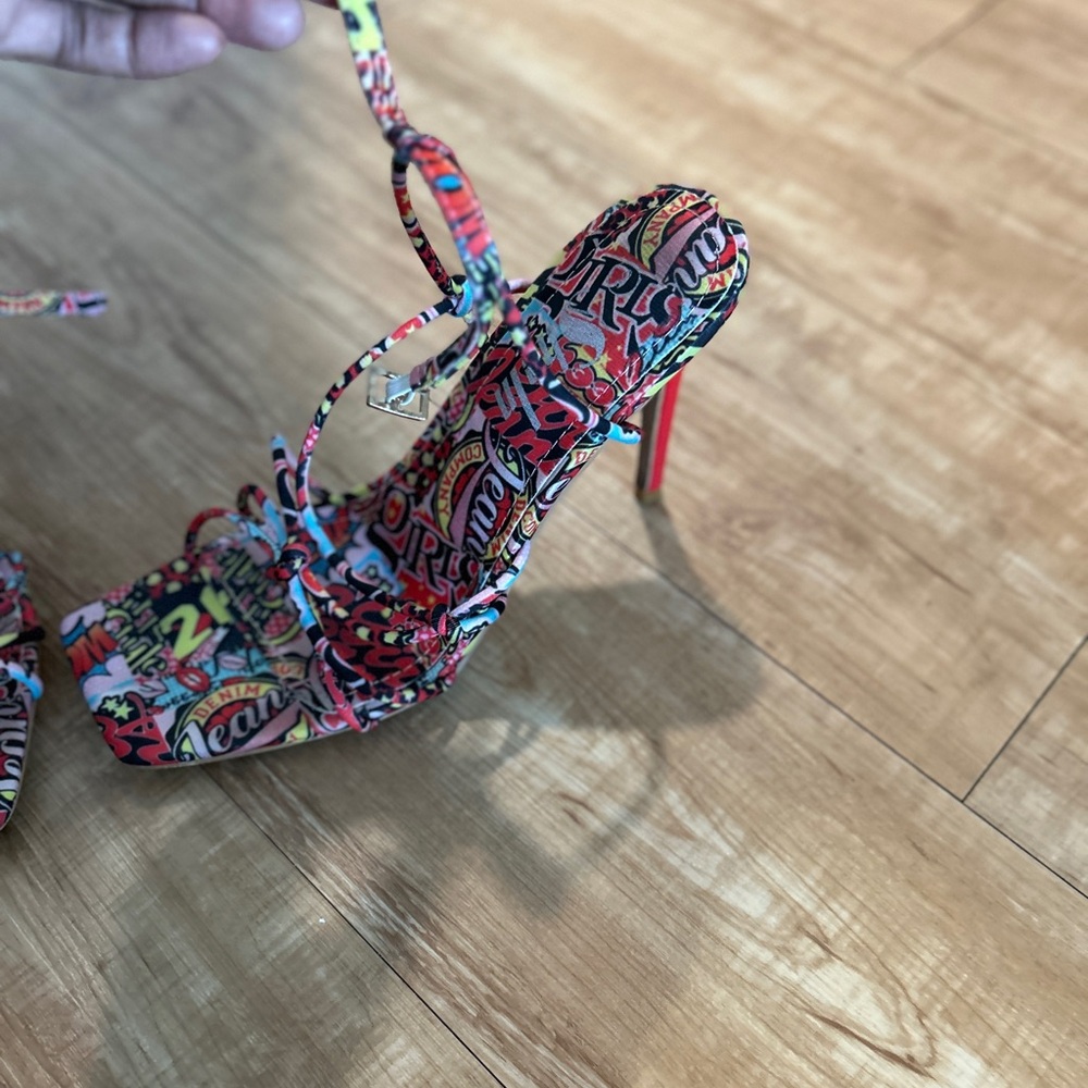 Multi colored sandal with red heel. About a 3.5 inch heel. Comfortable